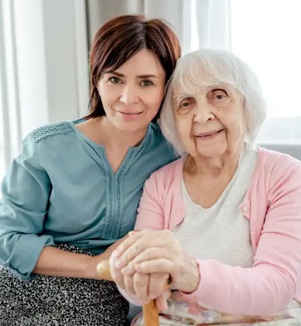 Elderly woman with caregiver